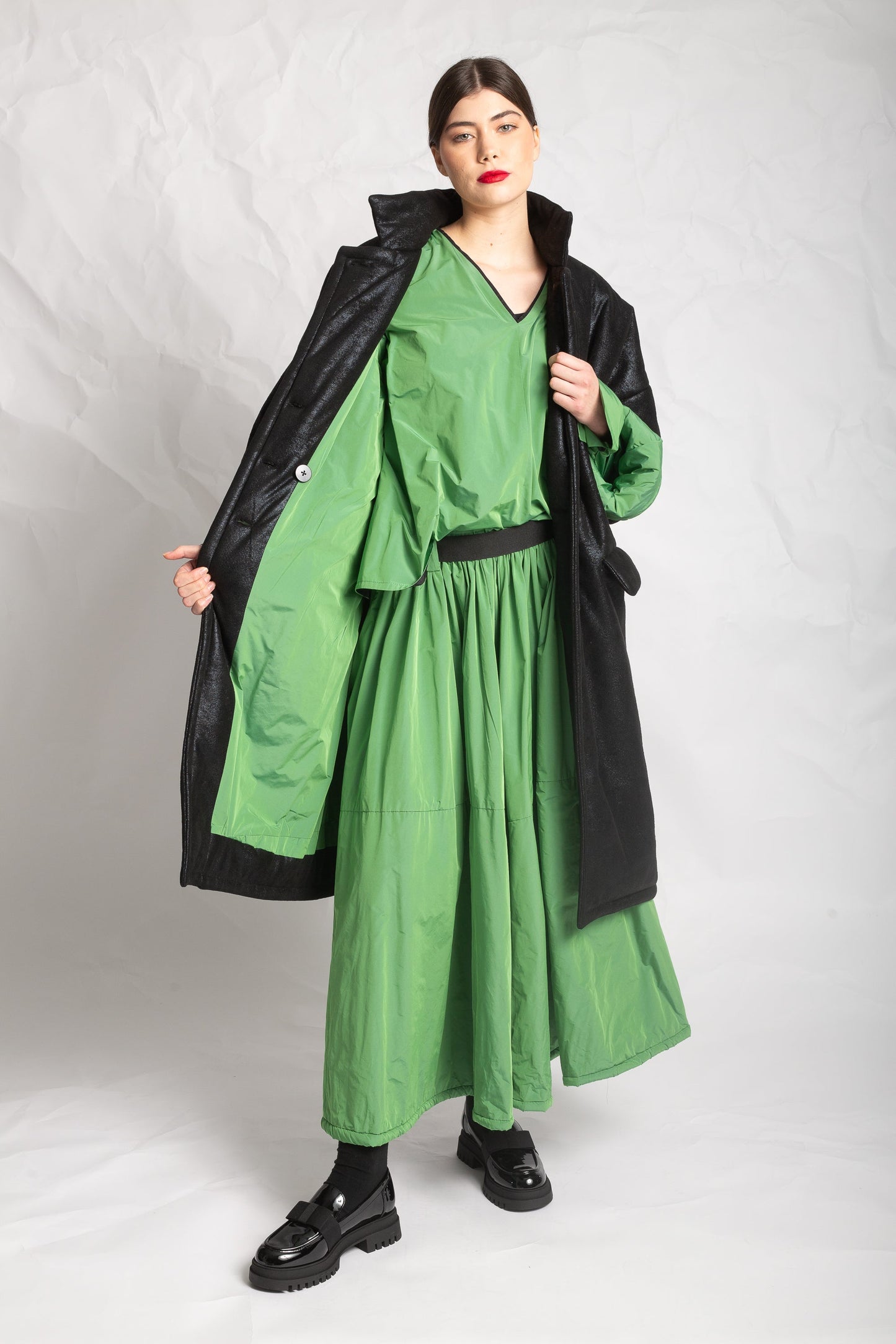 Les Filles D'ailleurs Black Coat With Striking Green LIner.